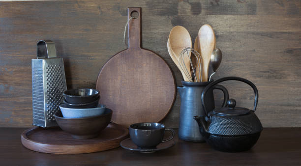 istock Crockery, clayware, dark utensils and other different stuff on wooden tabletop. Kitchen still life as background for design. Copy space. 1041748094