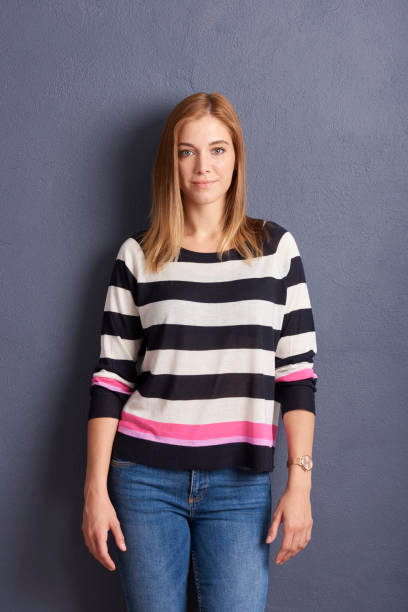 istock Smiling young woman studio portrait 1041752388