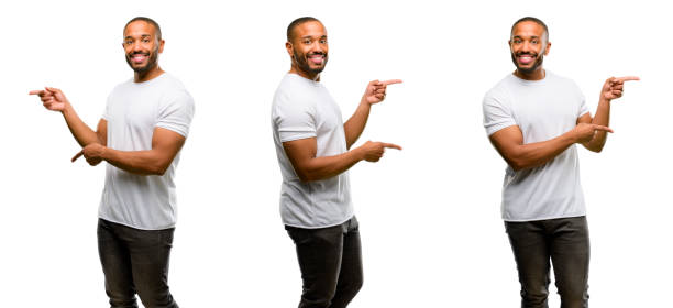 istock African american man with beard pointing away side with finger 1041757326
