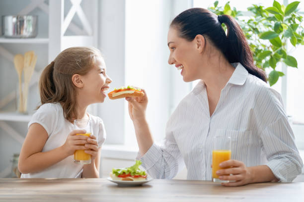 Happy family having breakfast.