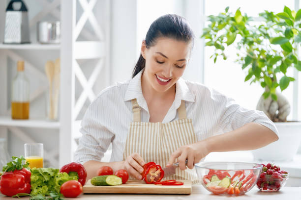 istock woman is cooking vegetables 1041757370