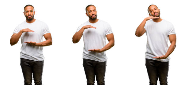 istock African american man with beard holding something, size concept 1041757372
