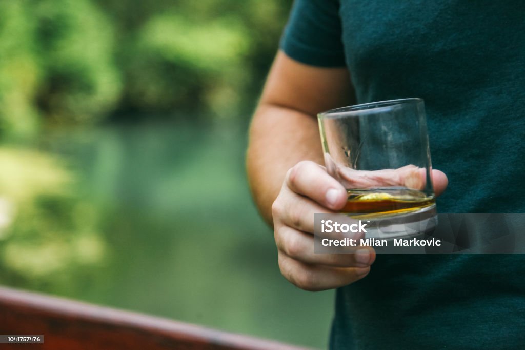 Holding glass with whiskey and smoking cigar Whiskey, Men, Businessman, Drinking, Males 30-34 Years Stock Photo