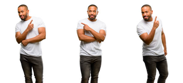 istock African american man with beard pointing away side with finger 1041757480
