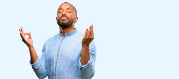 istock African american man with beard doing ok sign gesture with both hands expressing meditation and relaxation 1041757848