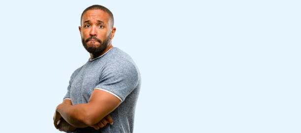 istock African american man with beard nervous and scared biting lips looking camera with impatient expression, pensive 1041758086
