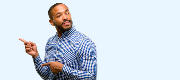 istock African american man with beard pointing away side with fingers 1041758566