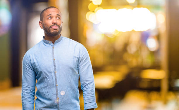 istock African american man with beard doubt expression, confuse and wonder concept, uncertain future 1041761242