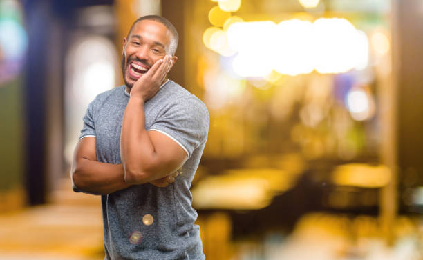 istock African american man with beard happy and surprised cheering expressing wow gesture 1041761440