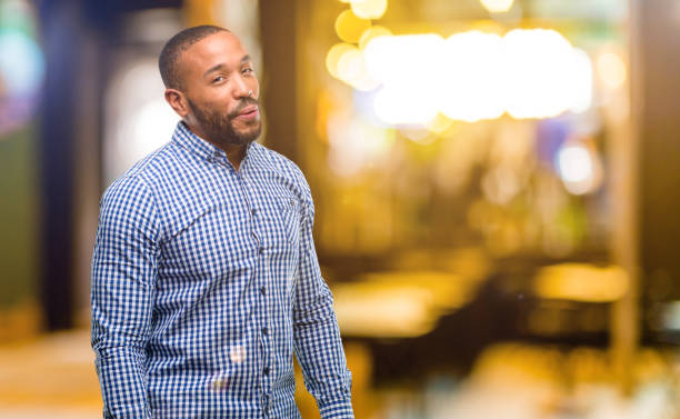 istock African american man with beard happy and surprised cheering expressing wow gesture 1041762100