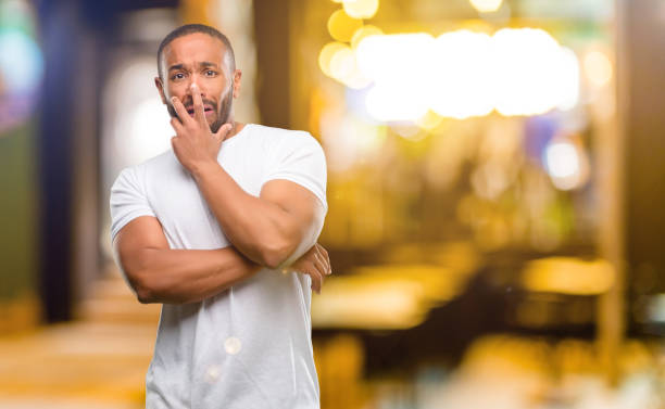 istock African american man with beard scared in shock, expressing panic and fear 1041762250
