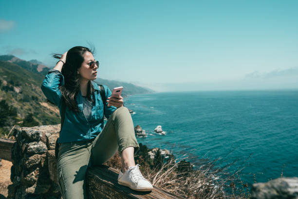 istock woman sitting on bench with one leg bending 1041767998