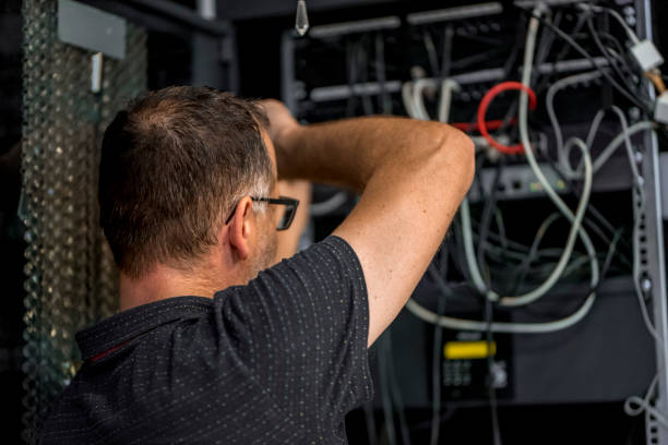 istock IT consultant working with network switches 1041769318