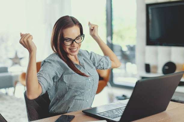 istock Happy businesswoman hands up while win 1041777678