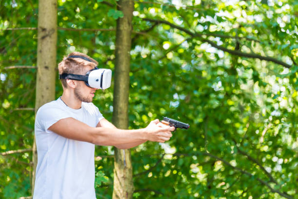 istock Shouting man in virtual reality headset playing video game 1041777990