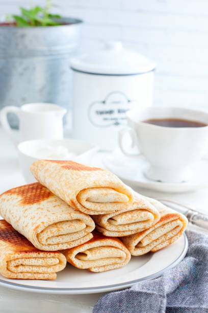 istock Stuffed pancakes on a white plate, selective focus 1041778878