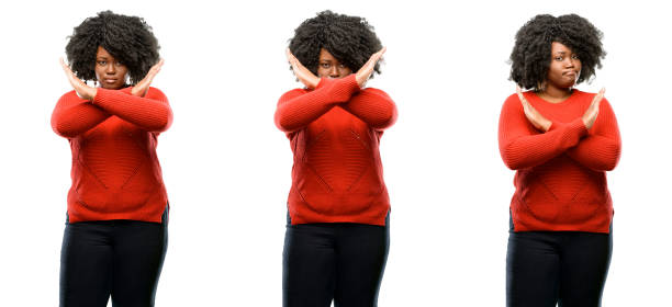 annoyed with bad attitude making stop sign crossing hands, saying no, expressing security, defense or restriction