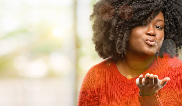 istock expressing love, blows kiss at camera, flirting 1041800770