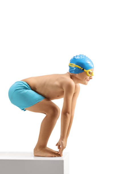 istock Young boy swimmer preparing to jump 1041800908