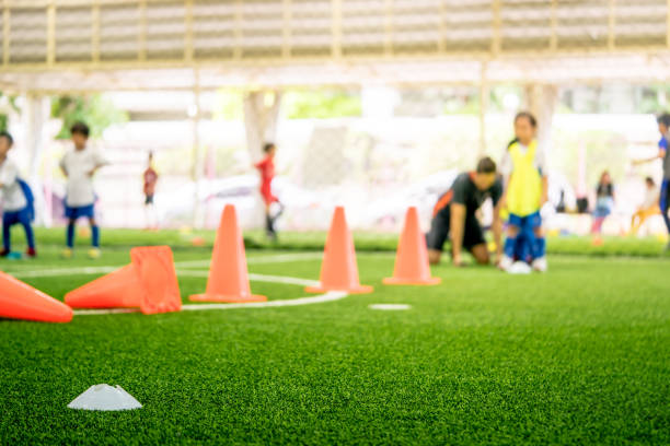istock Soccer training equipments on training ground with children 1041801714