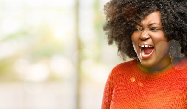 istock stressful, terrified in panic, shouting exasperated and frustrated. Unpleasant gesture. Annoying work drives me crazy 1041803340