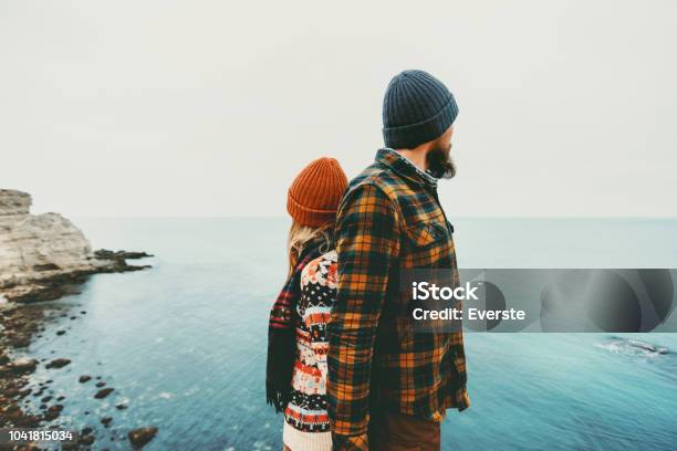 Couple Lovers Man And Woman Standing Backs Together Love And Travel Happy Emotions Lifestyle Concept Young Family Traveling Romantic Vacations Autumn Winter Season Stock Photo - Download Image Now