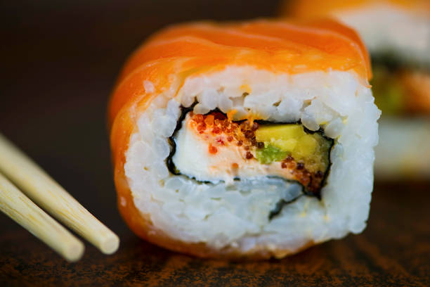 istock sushi with salmon, cheese and avocado 1041815538