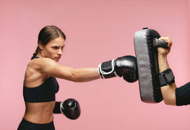 Sleet Unforeseen circumstances Temple Female Boxer In Gloves Training With Boxing Pads Stock Photo - Download Image Now - Padding, Boxing - Sport, Punching - iStock Sleet Unforeseen circumstances Temple Female Boxer In Gloves Training With Boxing Pads Stock Photo - Download Image Now - Padding, Boxing - Sport, Punching - iStock