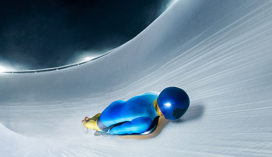 Skeleton sport. Bobsled. Luge. The athlete descends on a sleigh on an ice track.