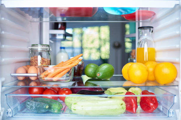 Opened fridge from the inside. Opened fridge from the inside full of vegetables, fruits and other groceries. refrigerator stock pictures, royalty-free photos & images