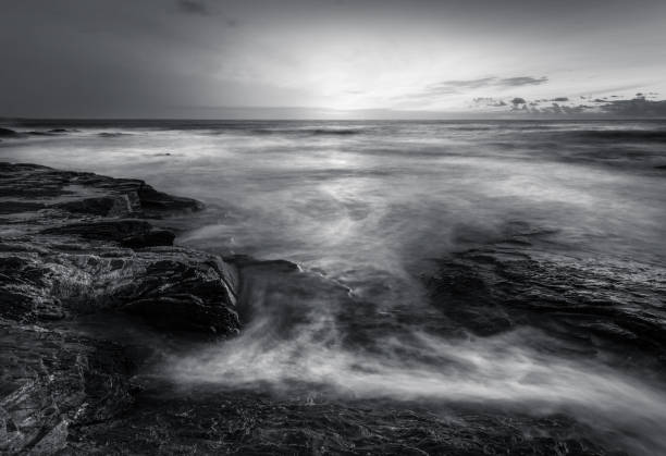 istock Sunlight and surf over coastal rocks, Constantine Bay 1041830344