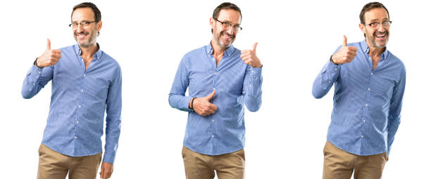 istock smiling broadly showing thumbs up gesture to camera, expression of like and approval 1041830792