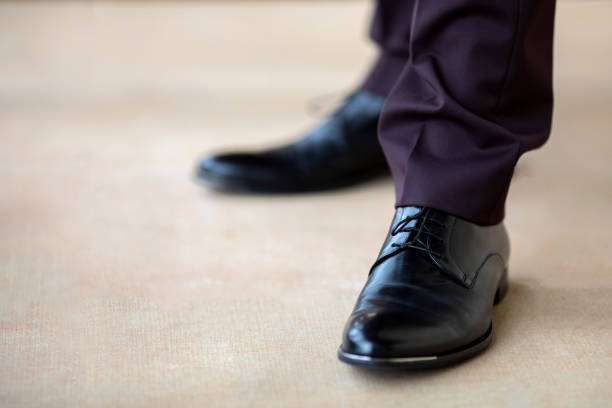 istock Groom wearing black leather man's shoes 1041836180