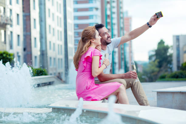 istock Nice cheerful positive man taking a selfie 1041839634