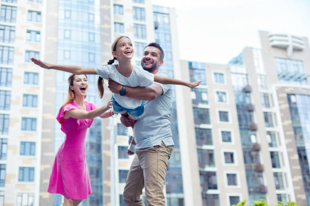 istock Delighted nice handsome man holding his daughter 1041839672