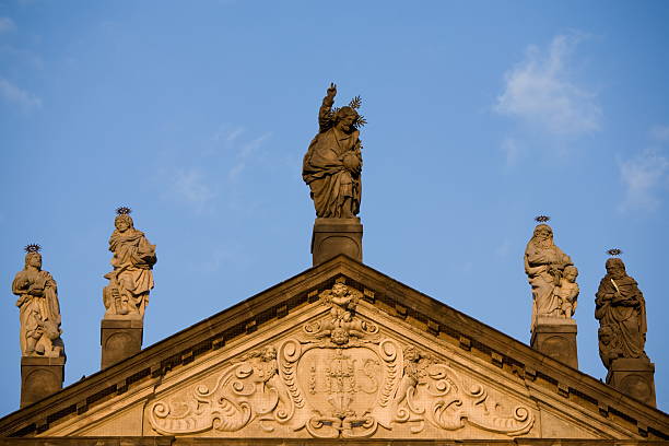 istock Church roof with St. statues 104185052