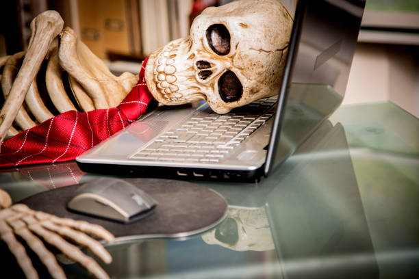 istock Skeleton businessman worked to death in office. 1041860364
