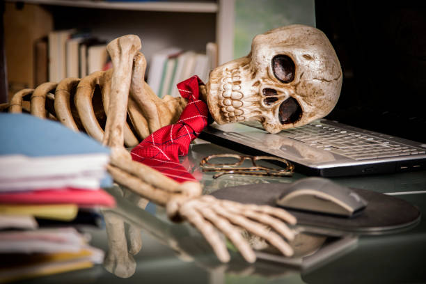istock Skeleton businessman worked to death in office. 1041860634