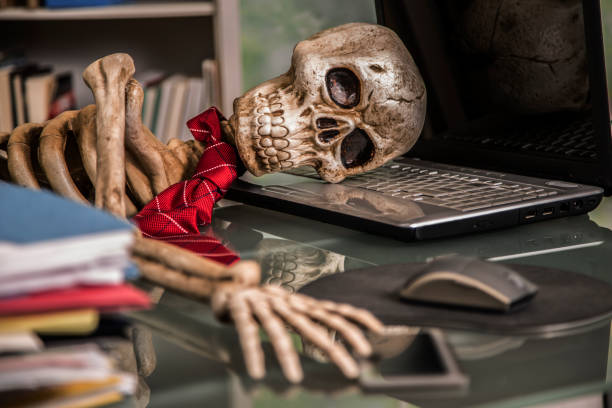 istock Skeleton businessman worked to death in office. 1041860700
