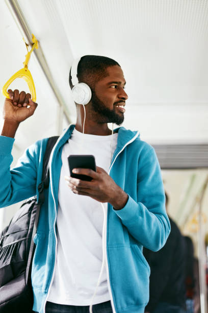 istock Man Using Phone, Listening Music Traveling In Train 1041861632