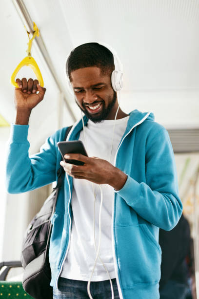 istock Man Using Phone, Listening Music Traveling In Train 1041861876