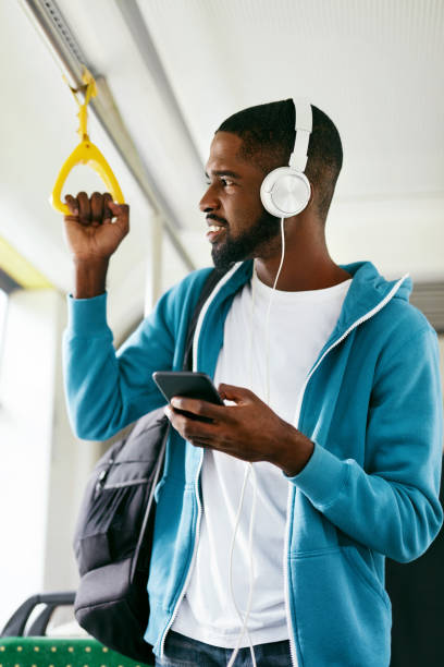 istock Man Using Phone, Listening Music Traveling In Train 1041862022