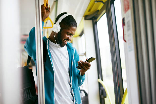 istock Man Using Phone, Listening Music Traveling In Train 1041862052