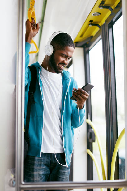 istock Man Using Phone, Listening Music Traveling In Train 1041862176