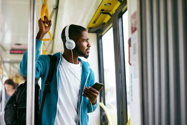 istock Man Using Phone, Listening Music Traveling In Train 1041862256