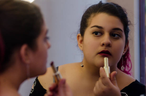 istock Chubby sexy woman putting on some makeup 1041868090