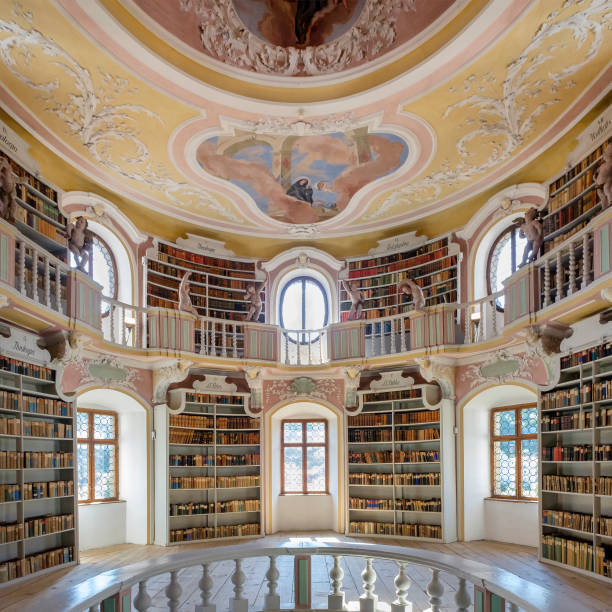 Füssen, Old Library at the St. Mang's Abbey (Bavaria, Germany) Old books divided by themes and ordered on shelves in the old Library at the St. Mang's Abbey, one of the landmarks of Füssen. st mang stock pictures, royalty-free photos & images