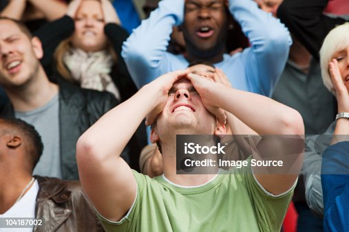 istock Disappointed football fan 104187002