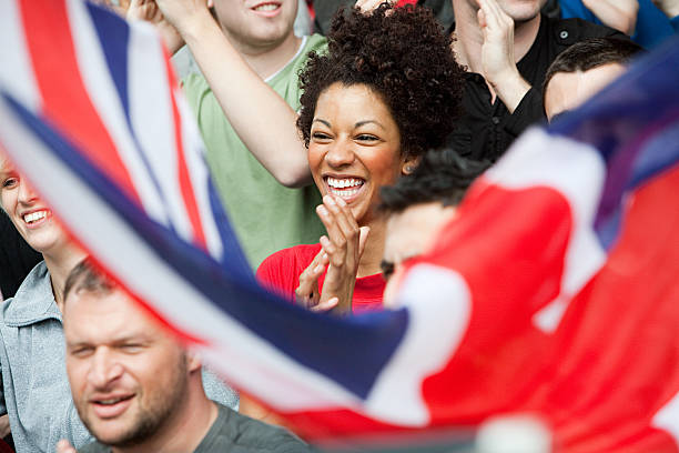 sostenitori con bandiera regno unito - outer london foto e immagini stock