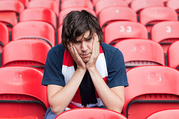 disappointed football fan in empty stadium - bleachers sport soccer fan стоковые фото и изображения